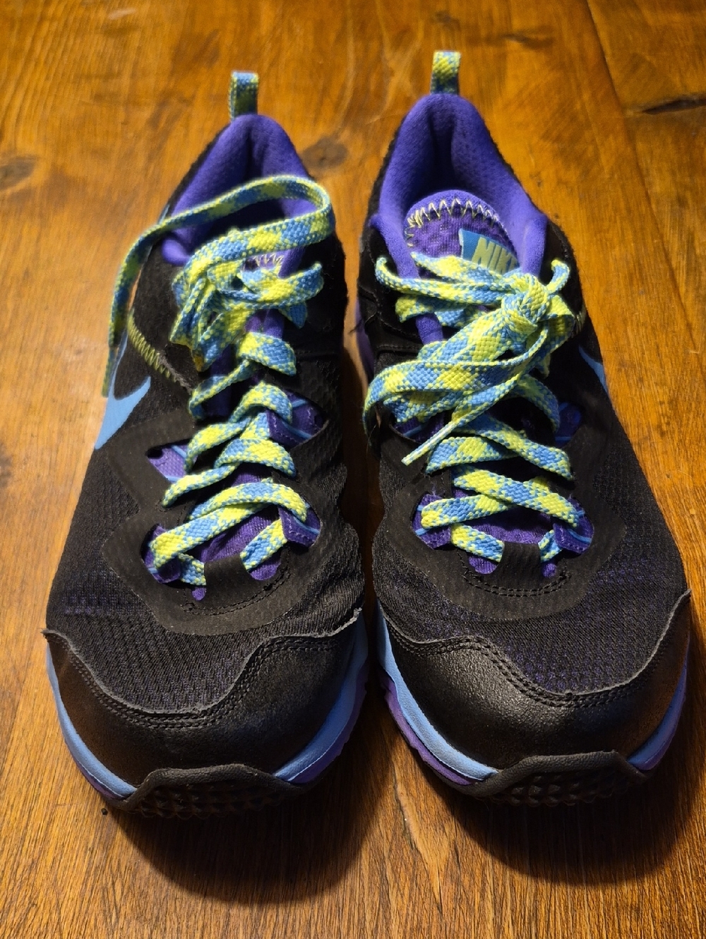 Nike Black Athletic Shoes with Purple Lining and Blue Swoosh